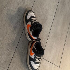 Nike Kids Black, White, and Orange Sneakers